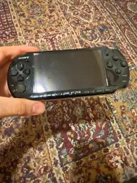 PSP 3000 for sale. W/Charger and one game.