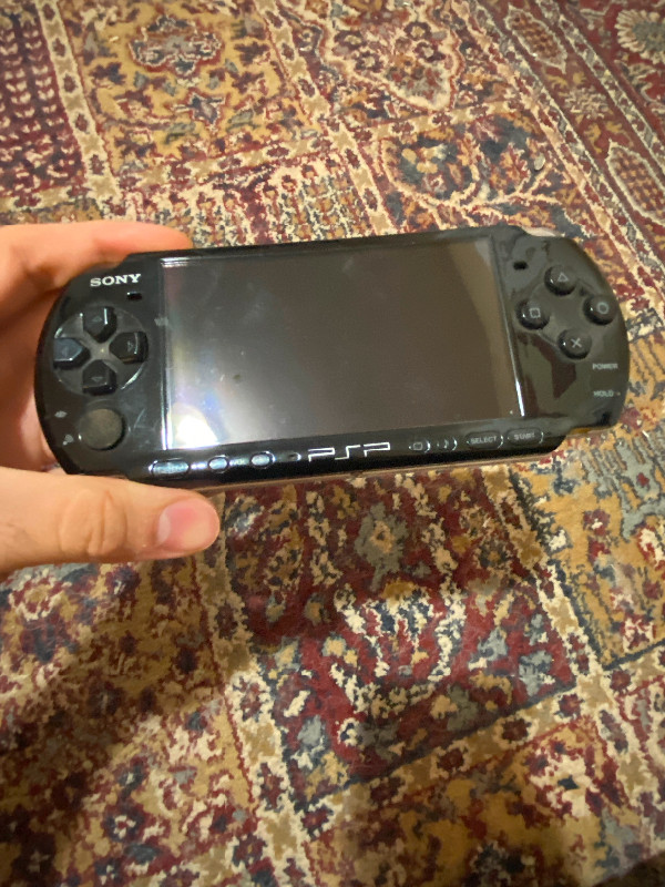 PSP 3000 for sale. W/Charger and one game. in Sony PSP & Vita in Markham / York Region
