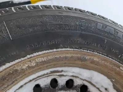 Four Michelin X-Ice 2 winter tires on steel rims, size 235/65R17. 7/32nd of tread wear remaining. Ca...
