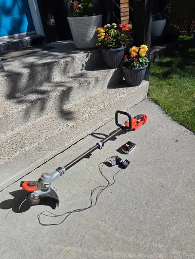 Cordless black and decker string trimmer. Includes one battery and charger