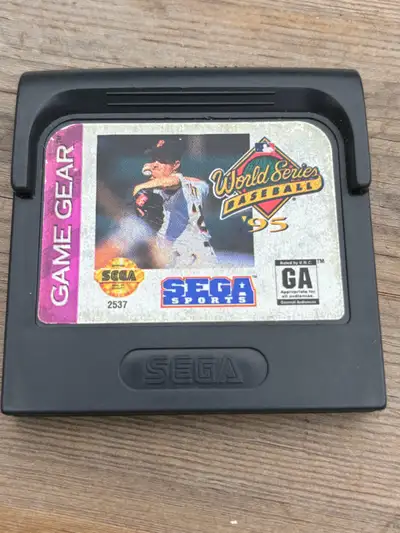 Step up to the plate with World Series Baseball '95 for the Sega Game Gear! This classic handheld ga...