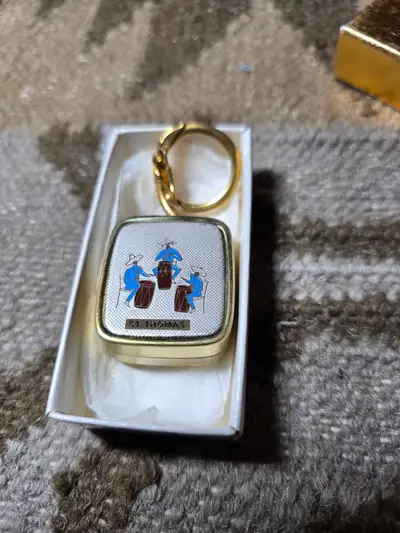 I'm offering a charming vintage music box keychain featuring a delightful scene of musicians in St....