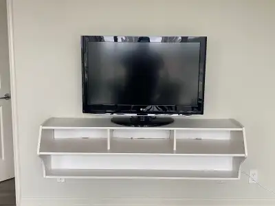 White mall mounted tv stand. TV not included.