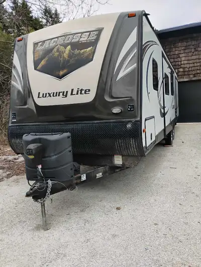 2015 Forest River lacrosse. Bunk beds in rear. Has fire place. Smart tv. 2 big Slides. Power landing...