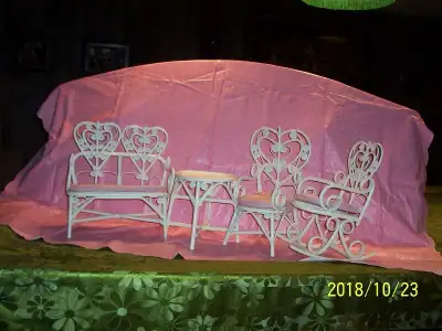 Intricate design white wicker set of four doll furniture., View more