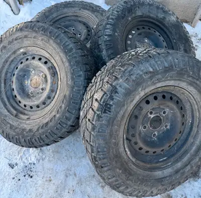 (4)- 265/70r16 Goodyear Wrangler All Terrain / All Season tires in rims. 5x139.7 Bolt pattern. Tires...