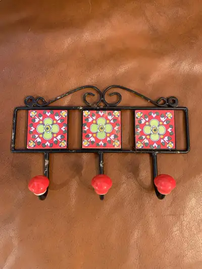 Add a touch of rustic charm to your home with this decorative tile hook rack, perfect for entryways,...