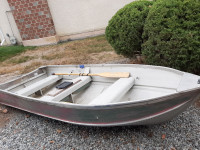 Aluminum boat, motor, and boat rack