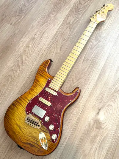 Custom Strat, One of a kind. Body is solid ash with a flame maple top Neck is flame maple with a fla...