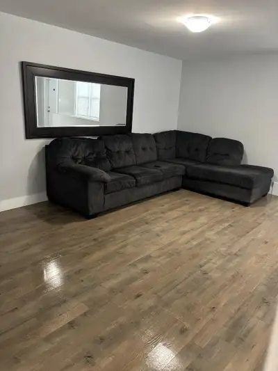 Black sectional couch. $50 or best offer. Will not deliver. Must pick up. Breaks into two pieces