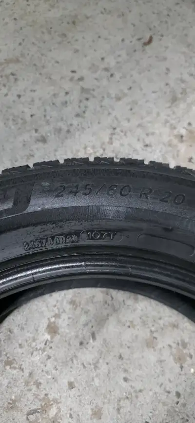 Selling a matched set of four Michelin X-Ice Snow SUV winter tires, size 245/60R20 107T. These are s...