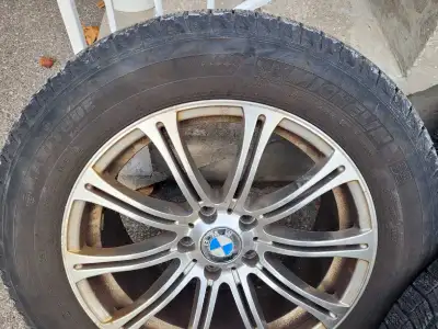 Selling a set of four used Michelin Latitude X-Ice Snow tires, sized at 255/55R18, complete with rim...