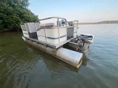 Selling my 12ft pontoon boat, 14ft pontoons in great shape, newer floor, 9.9 Evinrude yachtwin, runs...