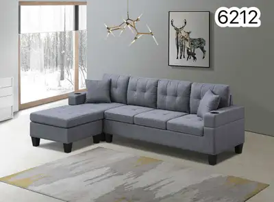 This is a modern, nearly new grey sectional sofa, perfect for adding comfort and style to your livin...