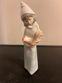 Ladro figurine. Girl with rooster.