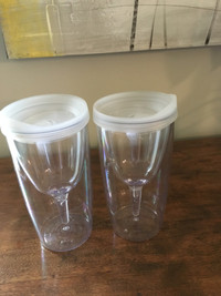 Two heavy plastic wine glasses