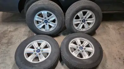 4 tires rims with tires in good shape of a 2019 ford f150 .