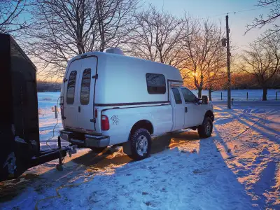 This is a Lightweight Spacekap Plus camper for 8' truck box. I'm 6' tall and I can stand up inside....