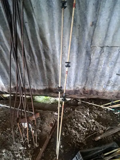 Electric Fence Wire Posts many with attached wire insulators... some are white fiberglass constructi...