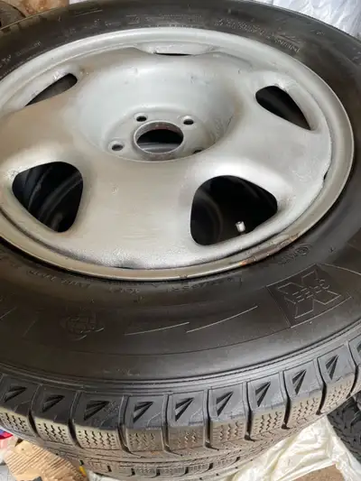 Set of four Excellent Michline winter tires/Acura rims. The tire number is 235-65-17. The tires have...