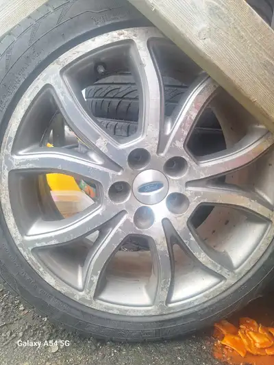 5 18 inch rims belong to a 2012 fordfusion On tires. 2 or 3 tires still decent $100