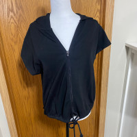 Female black zip up top or jacket 