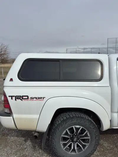 2005-2015 Toyota Tacoma short box Leer topper for sale. Colour is “Cool white”. Locks work, have 1 k...
