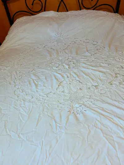 Two different antique lace duvet covers. Cotton, washable. Each costs $40. The patterns are slightly...