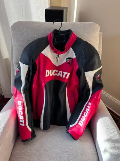 LIKE NEW!!! This original Dainese Ducati Corse 2 piece all leather motorcycle suit features perforat...