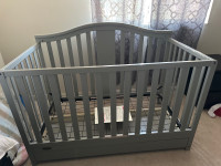 Baby crib with clean mattress and mattress cover 