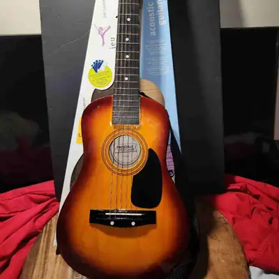 First act Wooden acoustic guitar with strap original box., View more