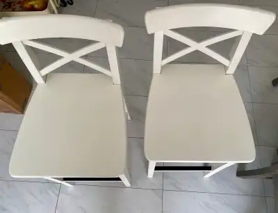 Add a touch of classic elegance to your dining space with these Ikea Ingolf chairs, perfect for any...