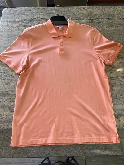 This is a new without tags Calvin Klein polo shirt, perfect for casual outings or a relaxed day at t...