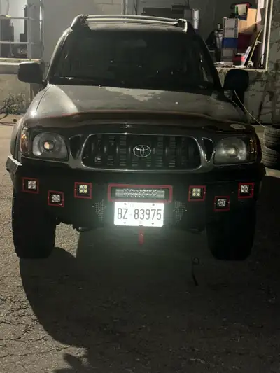 This black 2002 Toyota Tacoma pickup truck has 373000 km and is ready for anything with its 4x2 driv...