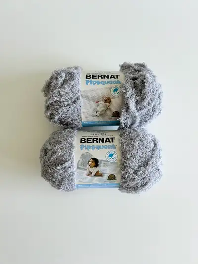 Brand new, Bernat pipsqueak yarn in color "elephant gray". 2 skeins both the same batch #. 100g each...