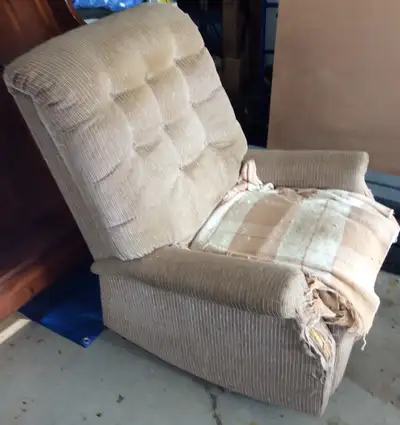 Beige La-Z-Boy recliner for sale with some wear just below the arm rests at the front. Otherwise in...