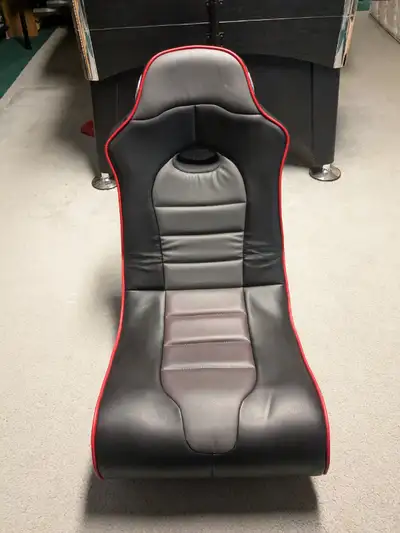 Rocker X gaming chair. Built in speakers and audio inputs. Foldable. Vinyl covering. $60