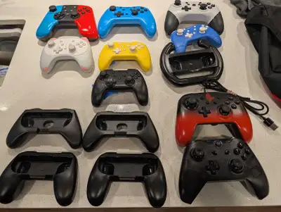 Nintendo Switch Wireless and wired controllers. Joy con grips, View more