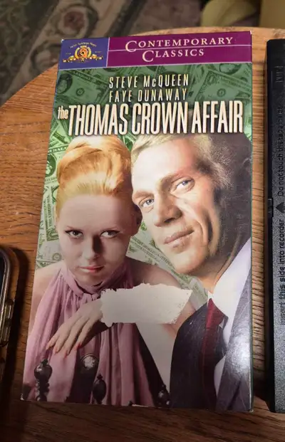 Relive the thrill of classic cinema with The Thomas Crown Affair on VHS, starring Steve McQueen and...