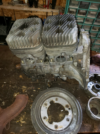 From a fan cooled 440cc Polaris Heads, cylinders, bottom end cases, recoil, y pipe
