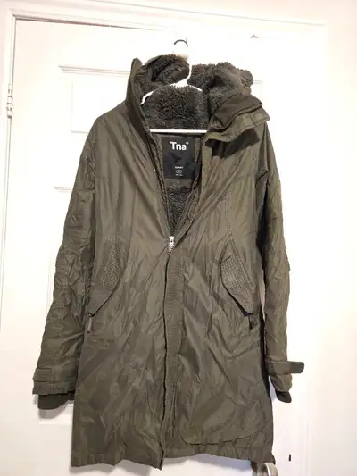 This is a TNA Summit parka in size XS. It's designed to keep you warm and stylish during colder weat...