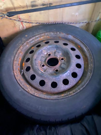 Four 4 hole, 15 inch rims with tires included