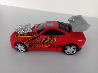Hot Wheels red hot rod battery operated car dated 2002.