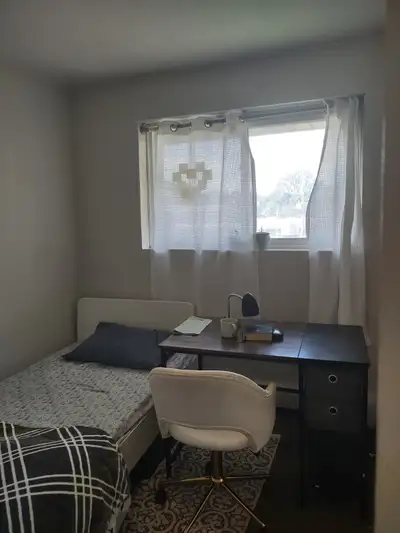 This cozy and well-lit private room features a comfortable single bed and a dedicated workspace, per...