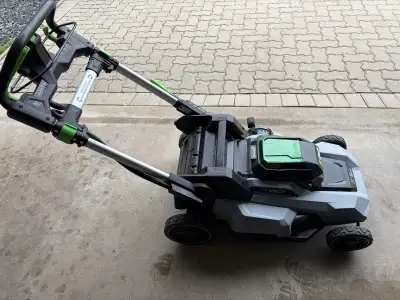 Used like new only used a handful of times No grass catch Comes with battery and battery charger