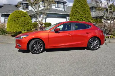 PRISTINE! This single owner, accident free, lady driven Mazda 3 GT Sport Premium looks and drives li...