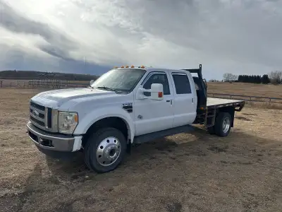 F550 flatdeck 6.4L Goose neck ball and fifth wheel hitches integrated with trailteck deck. Leather a...