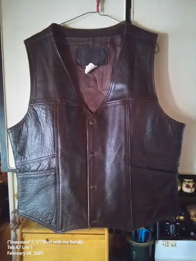 Mans genuine brown leather vest vintage and made of top quality leather removed from storage hasn't...