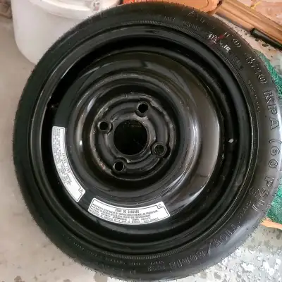 Selling a 13" Emergency Spare Tire (Donut) and Rim. In good condition, holds air perfectly. Great to...