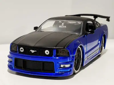 2006 Mustang GT blue/black 1:24 diecast model , View more